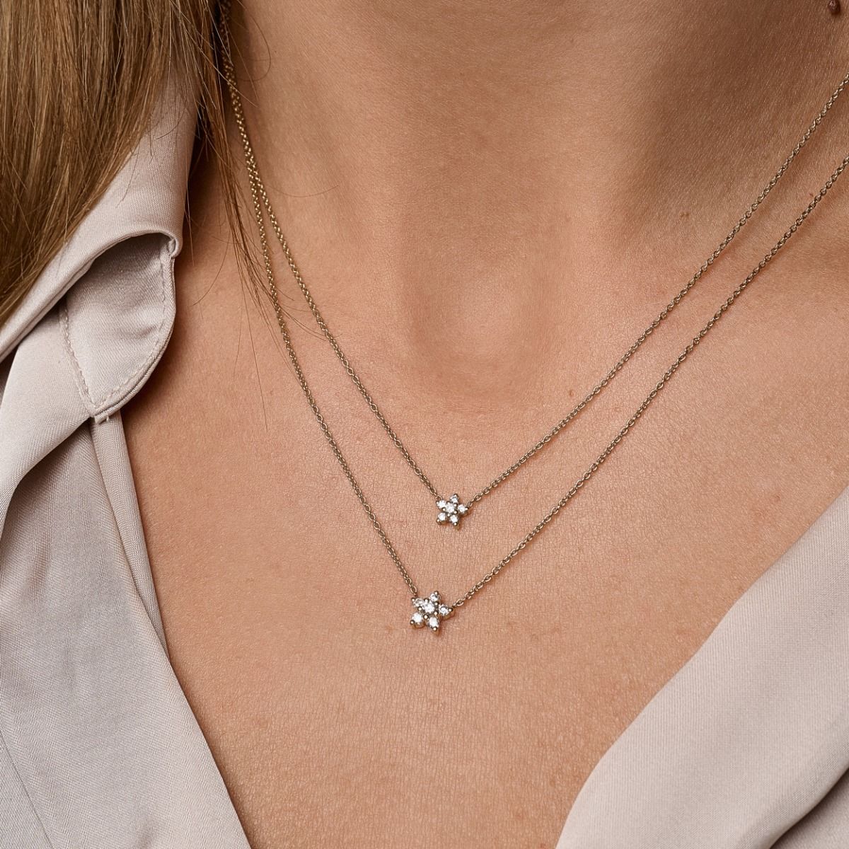 14 kt. Stella halskæde m/lille stjerne 0,11 ct. W-si.