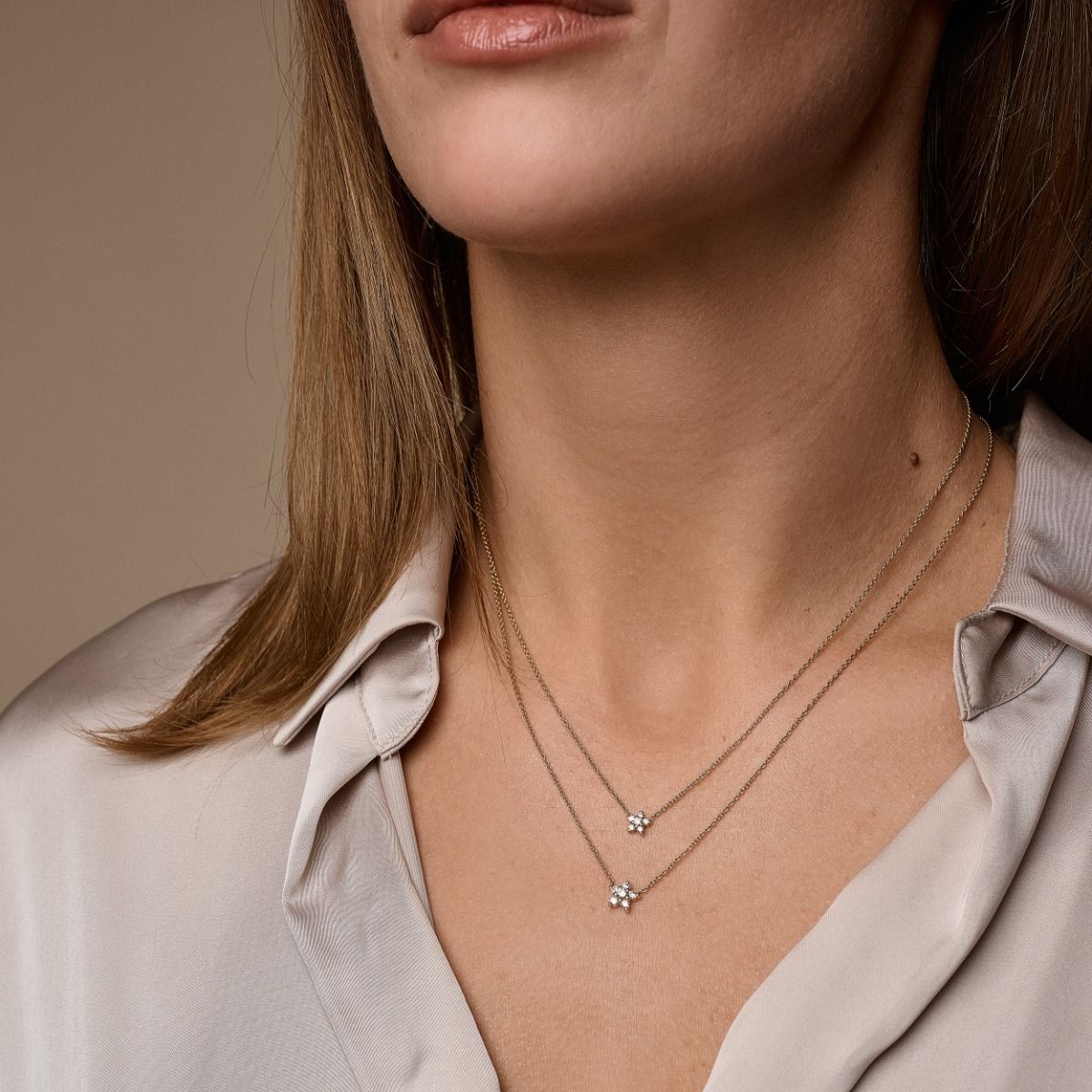 14 kt. Stella halskæde m/lille stjerne 0,11 ct. W-si.